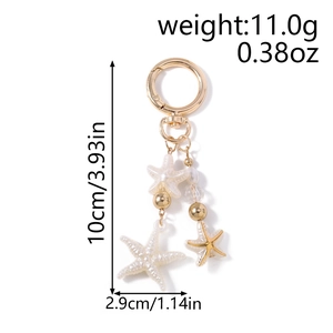 Detail of starfish keychain with dimensions 10cm by 2.9cm and pearl beads weight 11g