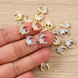 Macro shot of gold and silver celestial star and moon pendants for DIY jewelry making