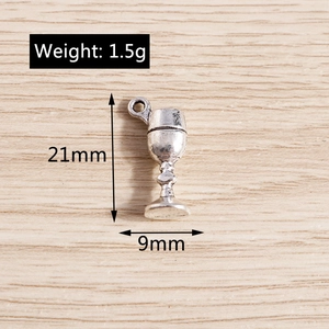 Detailed close-up of a vintage silver wine glass alloy charm with 21mm by 9mm dimensions
