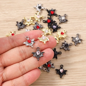 Detailed view of Gothic bat wing heart charms for DIY jewelry making in various colors