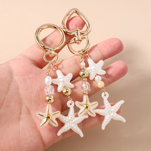 Handmade gold starfish keychain with striped beads and faux pearls for bag accessories