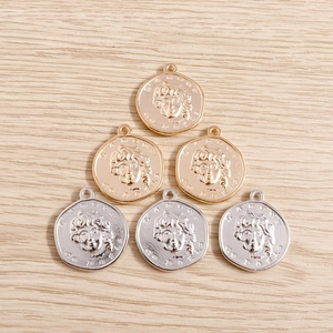 Set of 6 gold and silver irregular coin charms with portrait relief for DIY jewelry