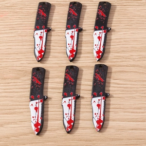 Detail of 6 mini acrylic cleaver charms with red blood splatters for DIY jewelry making