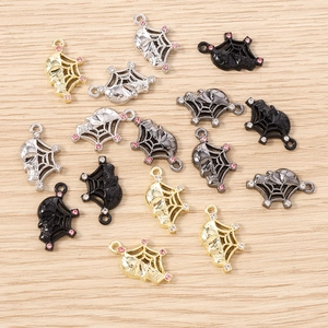 Gothic spider web and skull charms with rhinestones in gold silver and black