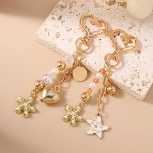 Porte-clés tendance doré avec perles cœur et étoile de mer pour décoration de sacs