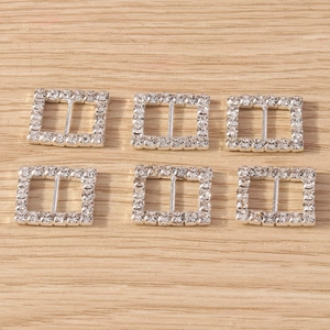 Detail of square rhinestone buckles with silver alloy frame and crystal embellishments