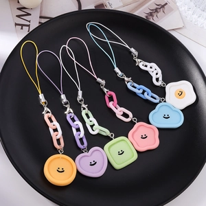 Dragonnes de téléphone en silicone avec cœurs souriants et pendentifs en forme d'œuf