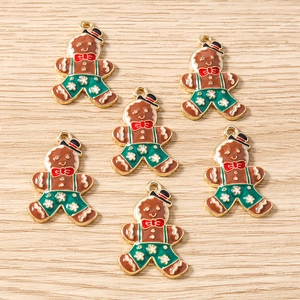 Détails des pendentifs bonhomme de pain d'épices avec émail fin et boucles dorées dorées