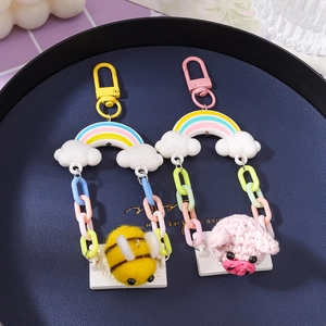 Handmade rainbow swing keychains with cute felt bee and crochet pig bag charms