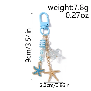 Détail du porte-clés étoile de mer avec dimensions 9cm et perles rayées bleues