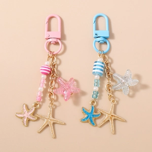 Porte-clés Étoile de Mer Perlé à la Mode Pendentif en Métal Résine Perle Rayée Porte-clés pour Sac Bijoux Femme Filles