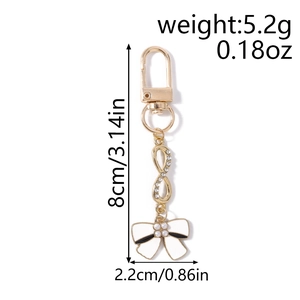 Infinity sign and white enamel bow keychain dimensions showing 8cm length and 5.2g weight