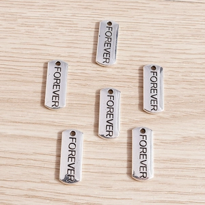 Set of six silver rectangle metal tags with Forever engraving for DIY jewelry making