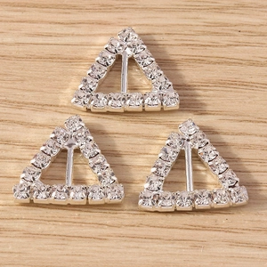 Close-up of geometric triangle DIY slider pendants with sparkling pavé rhinestones