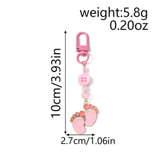 Pink enamel baby footprint keychain with beads and product dimensions specification