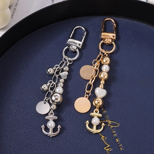 Porte-clés tendance en perles avec pendentif ancre et disque en métal doré et argent