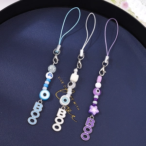 Detailed set of evil eye phone charms with BOO letters and stars in celestial style