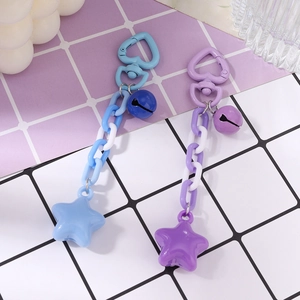 Star keychains with heart buckles and bells in pastel blue and purple colors