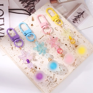 Starfish beaded keychains in purple, blue, pink, and yellow colors for bag decoration