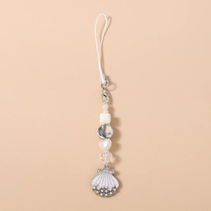 Detail shot of striped beaded phone chain with white shells and heart-shaped pearls