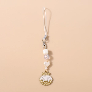 Detail of beaded mobile strap with white shell charm and faux pearl gold frame accent