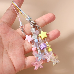 Fashionable beaded phone charm with iridescent starfish, colorful stars, and pearls