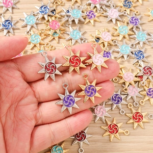 Detailed macro of octagonal star alloy charms with colorful enamel for DIY jewelry making
