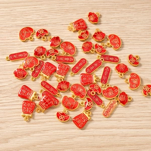 Chinese style red enamel lucky charms set for DIY jewelry making with wood background