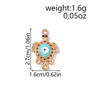Detailed view of turtle charms with evil eye inlay and double rings for DIY jewelry