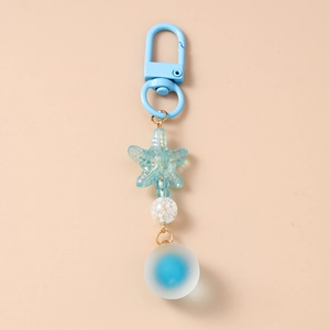 Detail of blue starfish pendant and frosted bead on a marine themed keychain