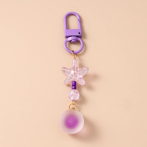 Detail of purple beaded keychain with starfish charm and frosted round gradient ball