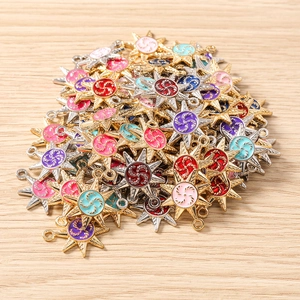 Close-up of colorful enamel star charms with sunburst design for DIY jewelry making