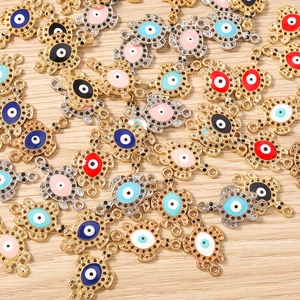 Detailed macro view of colorful enamel turtle evil eye connectors for DIY jewelry making