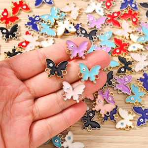 Enamel butterfly charms with evil eye design and gold trim for DIY jewelry making