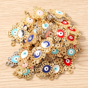 Detail shot of turtle evil eye charms in gold and silver finish for DIY jewelry