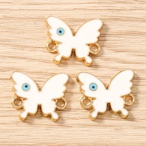 White enamel butterfly charms with blue evil eye design and gold metal connectors