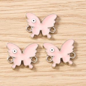 Pink enamel butterfly jewelry connectors with evil eye patterns for DIY crafting