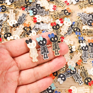 Skull charms with bow for DIY jewelry making in gothic style for earrings and necklaces