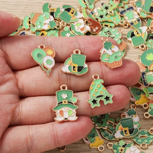 Macro detail of St. Patrick's Day green enamel charms with luck themes and golden plating