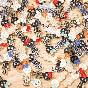 Macro view of colorful bow skull charms with alloy drip oil finish for DIY jewelry