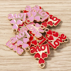 Macro detail of alloy enamel LOVE heart pendants for DIY jewelry and bracelets