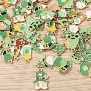 Detailed view of St. Patrick's Day enamel charms featuring gnomes and green shamrocks