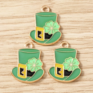 Detail view of St. Patrick’s Day green hat charms with shamrock and gold enamel finish