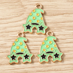 Close-up of three green wizard hat enamel charms with yellow dots for DIY jewelry making