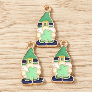 Macro view of St. Patrick's Day gnome charms with green hats and lucky four-leaf clovers
