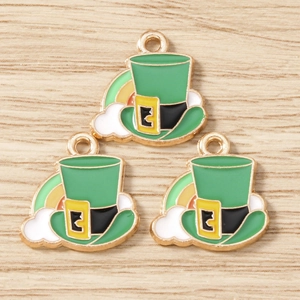 Detailed macro view of St. Patrick's Day green hat and rainbow enamel charms for DIY jewelry