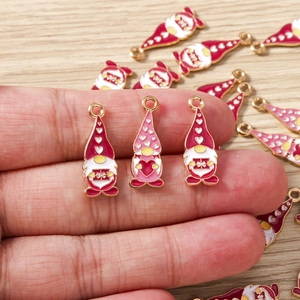 Detailed view of gnome charms with colorful enamel finish for festive DIY jewelry making