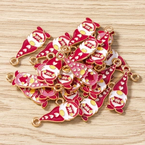 Detailed close-up of 10-piece Christmas gnome charms with red heart hats and gold edges