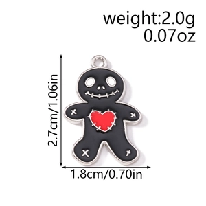 Detailed view of black enamel voodoo doll pendant with red heart and size measurements