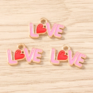 Macro detail of LOVE heart enamel alloy pendants for DIY jewelry and earrings